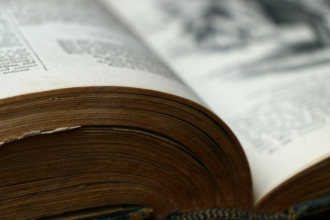 detective reading old book