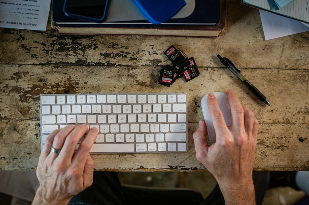 writer typing at desk